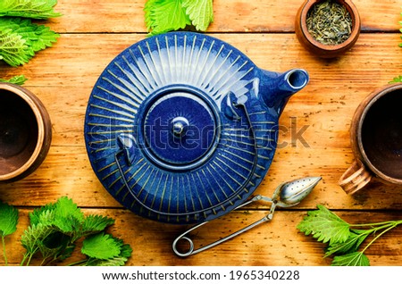 Fresh herbal tea with nettle leaves.Herbal medicine,homeopathy.Tea drinking