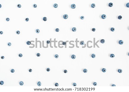 Blueberries on white background. Food blog or magazine concept texture