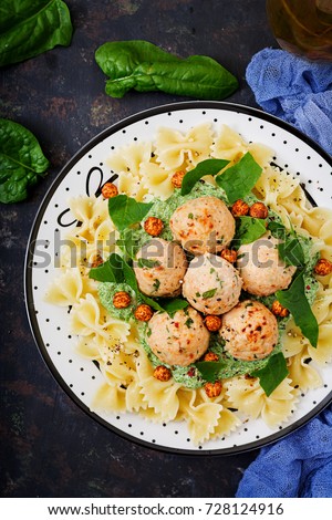 Farfalle pasta with meatballs and spinach  sauce with fried chickpeas. Proper nutrition. Sports nutrition. Dietary menu. Flat lay. Top view