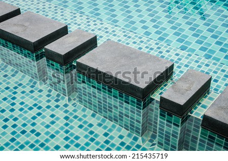 grey sand wash way across swimming pool
