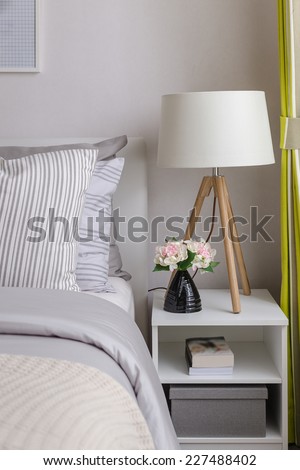 modern bedroom with wood lamp on table at home
