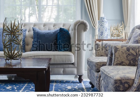 luxury living room with sofa on blue pattern carpet
