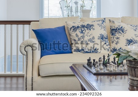 luxury living room with blue pillows on sofa