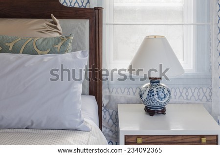 chinese lamp style on white table side in luxury bedroom