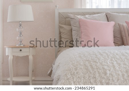 pink pillow on white luxury bed in bedroom at home