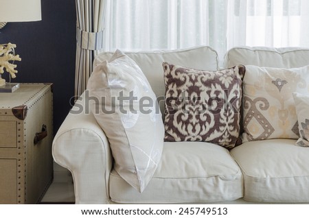beige color sofa and pillows in living room at home