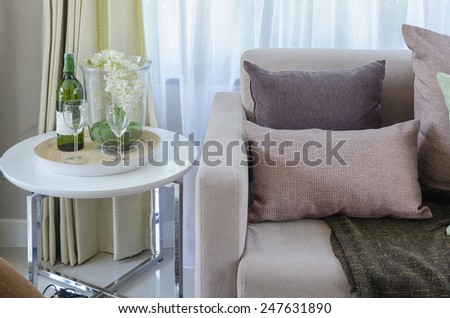 pillows with blanket on sofa in living room at home
