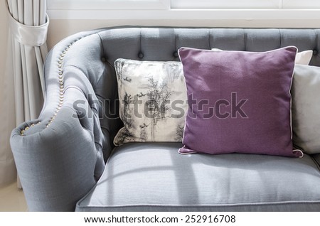 purple pillow on classic sofa style in living room at home