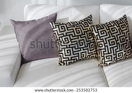 gold pillows with chinese pattern style on white sofa in living room