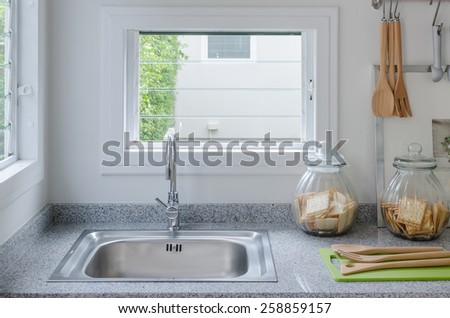 stainless steel sink in modern kitchen at home