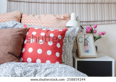 kid\'s bedroom with colorful pillows on bed at home