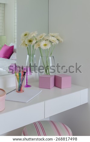 glass vase of flower on white dressing table at home