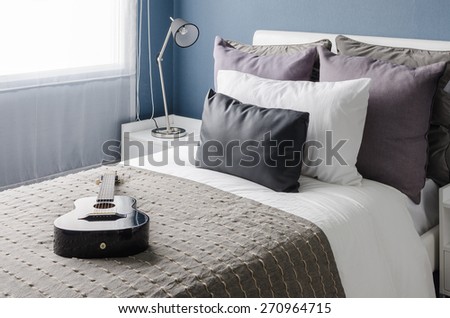 modern black lamp on white table in modern bedroom with blue wall