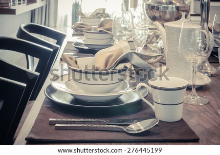 luxury table set on dinning table - vintage style picture effect