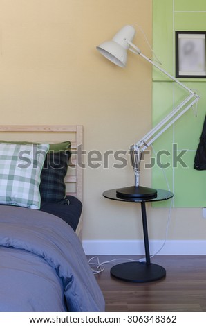 modern white lamp on black table in modern bedroom