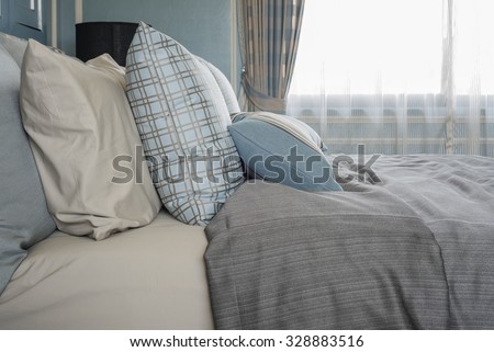 classic bedroom style with row of pillows on bed