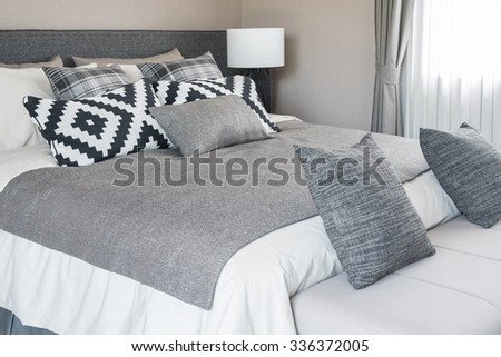 bed and pillows in modern bedroom, black and white color tone
