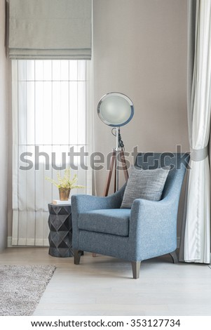 classic style sofa with pillows and modern lamp in living room