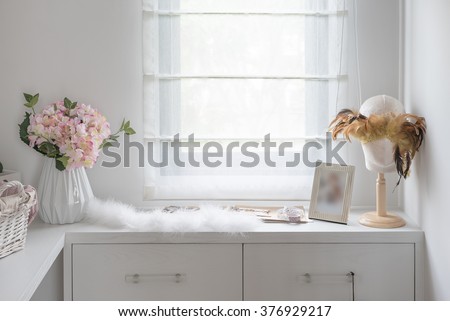women\'s dressing table with vase of flower