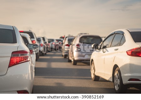 row of cars on express way, traffic jam with morning light