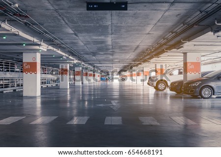 interior of parking garage with car and vacant parking lot in parking building, vintage style process