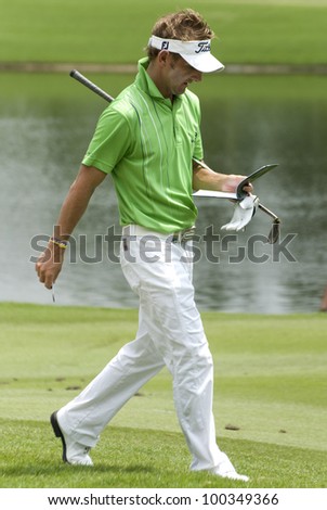 KUALA LUMPUR- APRIL 15: Jbe Kruger of South Africa looking at his scorecard after makes eagles in the 16th green during final of Maybank Malaysian Open 2012 at Kuala Lumpur, Malaysia on April 15, 2012