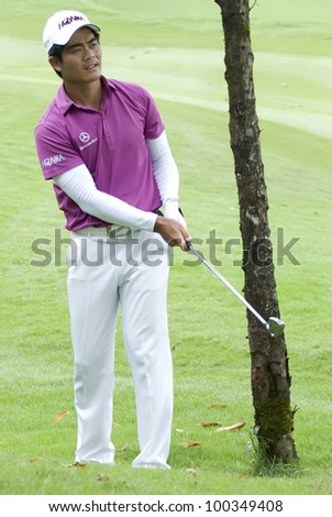  - stock-photo-kuala-lumpur-april-liang-wen-chong-of-china-hits-shot-in-the-th-holes-during-final-round-of-100349408