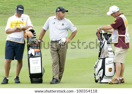 KUALA LUMPUR - APRIL 15: Hennie Otto of South Africa chatting with the caddy during final match of Maybank Malaysian Open 2012 at Kuala Lumpur Golf & Country Club on April 15, 2012