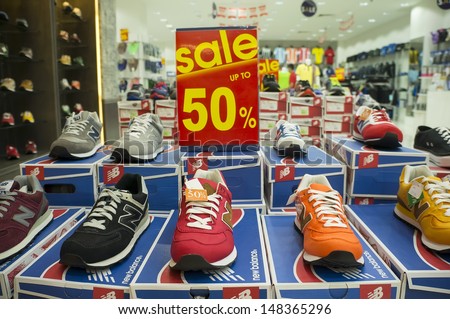KUALA LUMPUR - JULY 31: Shoe stores make sales in conjunction with the 'Eid Fitr and 1Malaysia Mega Sale Carnival in Kuala Lumpur, Malaysia on July 31, 2013.