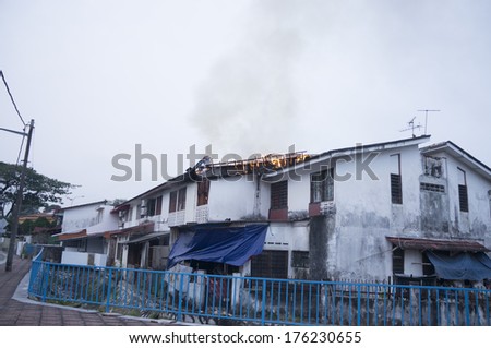 KUALA LUMPUR-FEB 12: A fire to burn the roof of a house on fire in Taman Sri Rampai, Setapak, Kuala Lumpur, Malaysia on February 12, 2014