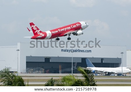 SEPANG, MALAYSIA - AUGT 4: Airbus A320 registered with number 9M-AQY owned by Air Asia take off from Kuala Lumpur International Air Port, Sepang, Malaysia on August 4, 2014.