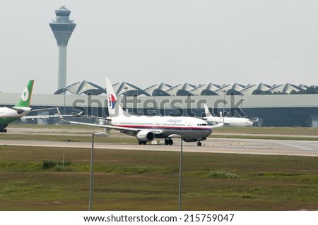 SEPANG, MALAYSIA - AUGT 4: Boeing 737-8H6(WL) registered with number 9M-MLF owned by Malaysia Airlines(MAS) take off at Kuala Lumpur International Air Port, Sepang, Malaysia on August 4, 2014