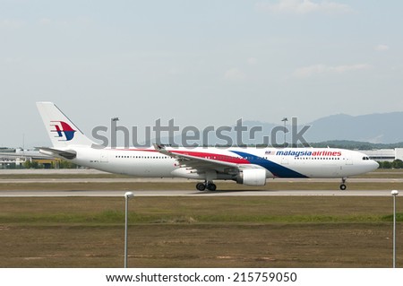 SEPANG, MALAYSIA - AUGT 4: Airbus A330 registered with number 9M-MTL owned by Malaysia Airlines (MAS)  ready to take off from Kuala Lumpur International Air Port, Sepang, Malaysia on August 4, 2014.