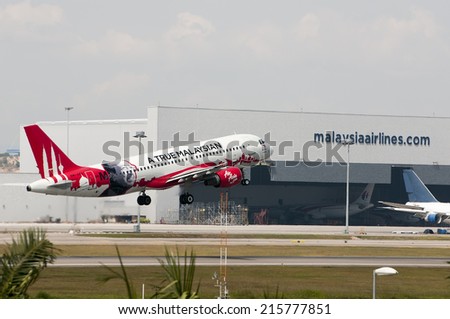 SEPANG, MALAYSIA - AUGT 4: Airbus A320 registered with number 9M-AFO owned by Air Asia take off from Kuala Lumpur International Air Port, Sepang, Malaysia on August 4, 2014.