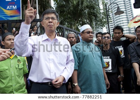 KUALA LUMPUR, MALAYSIA-MAY 20: Malaysian politician, Tian Chua joint a protest against a proposed rare earth plant to be built in Gebeng, in front of Petronas Twin Towers in Kuala Lumpur May 20, 2011.