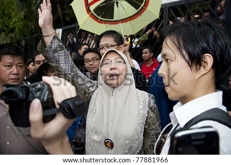 KUALA LUMPUR, MALAYSIA-MAY 20: Malaysian politician, Fuziah joint a protest against a proposed rare earth plant to be built in Gebeng, in front of Petronas Twin Towers in Kuala Lumpur May 20, 2011.