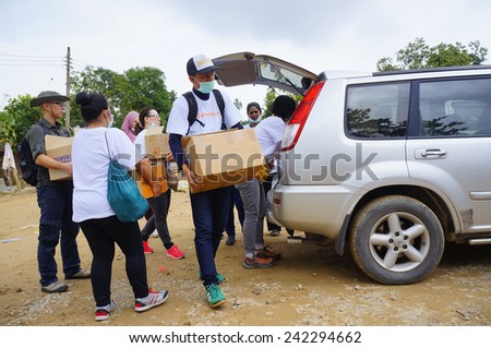 TANAH MERAH, KELANTAN - JANUARY 2: Medical team from OPS Harapan make preparation a mobile clinic for flood victims in Kusial Baru village, Tanah Merah, Kelantan on January 2, 2015