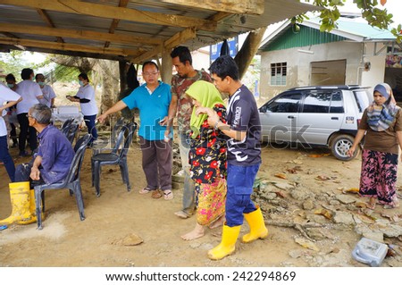TANAH MERAH, KELANTAN - JANUARY 2: Flood victims visited a mobile clinic for a medical examination in Kusial Baru village, Tanah Merah, Kelantan on January 2, 2015