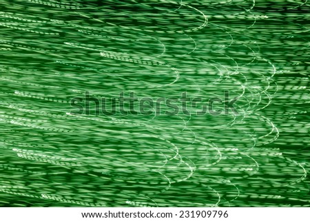 Pattern of playing with light on green background, Abstract green light play
