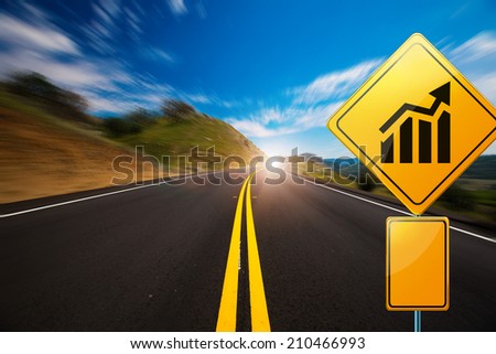 windy road with a sign showing a diagram