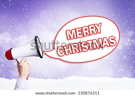 megaphone in front a star background with the message merry christmas in a speech bubble