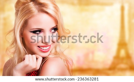 attractive blonde girl in front of a painted paris background