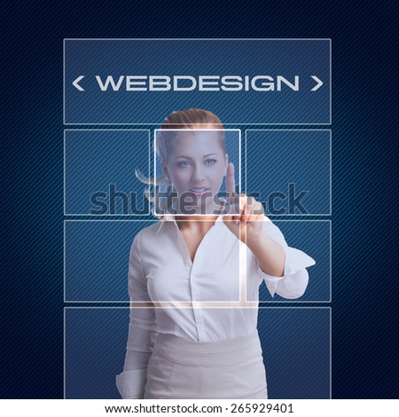 young businesswoman using a virtual touchscreen to do web design