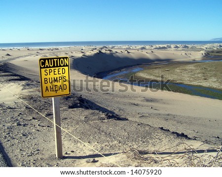 Speed bump sign with dunes