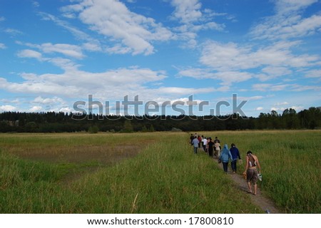Line of people in a field