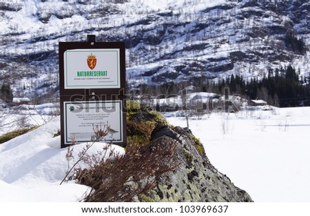 VAKSDAL, NORWAY - APRIL 6: A signpost for the Nesheimvatnet wetlands nature reserve in Hordaland county stands nestled in snow on April 6, 2012. This nature reserve was established 15 December 1995.