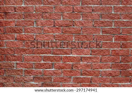 Wall from a red brick close up