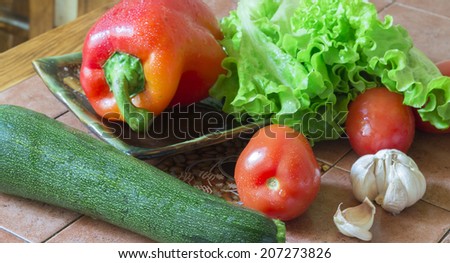 vegetable still life with tomato salad and zucchini