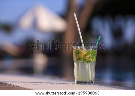 Mojito Drink standing at the edge of the swimming pool