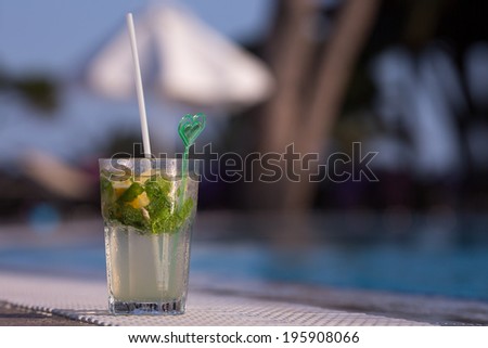 Mojito Drink standing at the edge of the swimming pool
